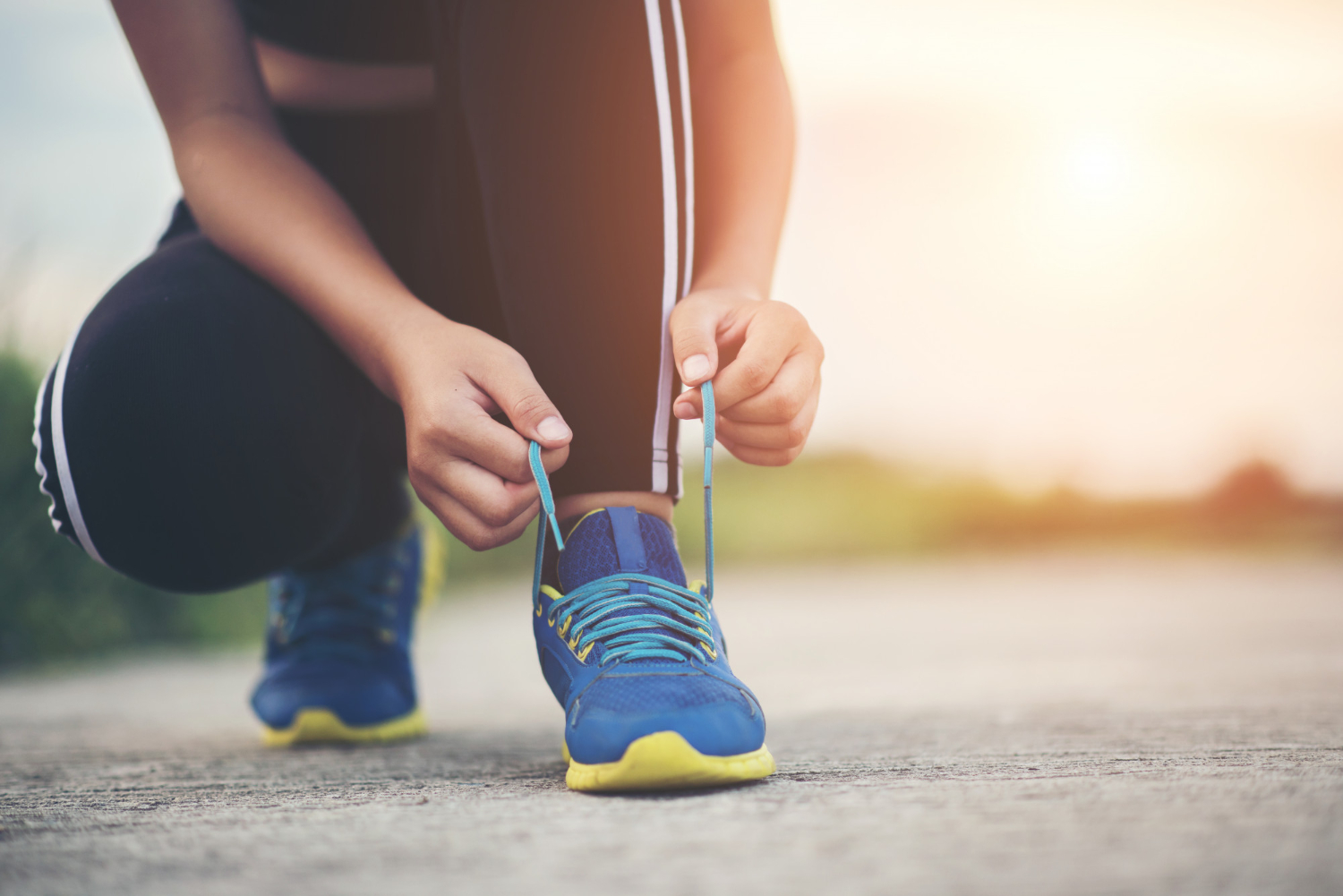 close-up-shoes-female-runner-tying-her-shoes-jogging-exercise
